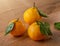 ÐœÐ°Ð½Ð´Ð°Ñ€Ð¸Ð½Ñ‹ Ñ ÐºÐ°Ð¿Ð»ÑÐ¼Ð¸ Ð²Ð¾Ð´Ñ‹ Ð½Ð° Ð´ÐµÑ€ÐµÐ²ÑÐ½Ð½Ð¾Ð¼ ÑÑ‚Ð¾Ð»Ðµ Tangerines with water drops on a wooden table